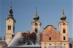 Towers of Baroque Michaelerkirche church dating from 1635, at sunset, Michaelerplatz, Steyr, Oberosterreich (Upper Austria), Austria, Europe