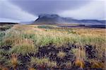 Mount Lomagnupur, 767 m, near Nupsstadur is a remarkable landmark above the flat black sand expanses of Skeidararsandur, south-east Iceland (Austurland), Iceland, Polar Regions