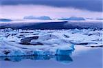 Jokulsarlon glacial lagoon beneath Breidarmerkurjokull (Vatnajokull) glacier which feeds it, south-east Iceland (Austurland), Iceland, Polar Regions