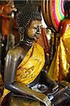 Buddha statue with offerings at Wat Phnom temple, Phnom Penh, Cambodia, Indochina, Southeast Asia, Asia