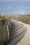 Sand held in place by fence on South Beach in Miami Beach, Florida, United States of America, North America