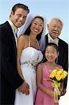 Bride and Groom with father and sister, outdoors, (portrait)