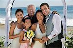 Bride and Groom with family at beach wedding, (portrait)