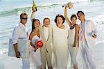 Family celebrating wedding on beach