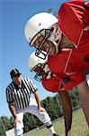 Referee Watching Football Players on field