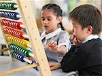 Elementary students using abacus in classroom