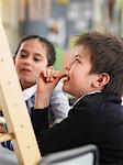 Elementary students sitting in classroom