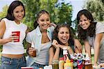 Four women at picnic.