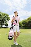 Woman Carrying Golf Bag