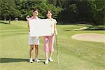Women Holding White Board On Golf Course