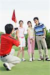 Man Taking A Picture On Golf Course