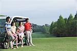 Men And Women With Golf Cart