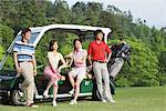 Men And Women With Golf Cart