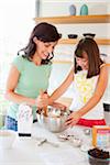 Mother and Daughter Baking Cookies, Portland, Oregon, USA