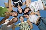 Group of friends in circle, view from below, portrait