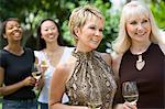 Female friends drinking wine outdoors