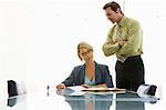 Business man and woman working in conference room