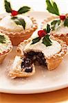 Decorated mince pies on plate, close-up