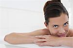 Woman relaxing in bathtub, close-up, portrait