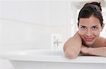 Woman relaxing in bathtub, portrait