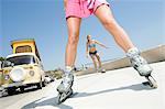 Young women on rollerblades