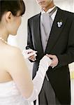 Bride and groom holding hands
