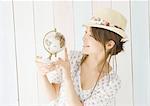 Young woman holding globe