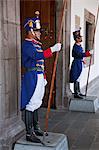 Ecuador, Ceremonial guards, granaderos, at the entrance to Palacio de Gobierno in the Old City, Quito.