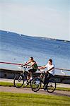 Estonia, Tallinn, Boy And Girl Cycling Along Pirita Tee