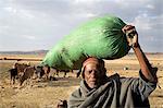 Ethiopia, Debre Markos. An old man with a sack of grain outside Debre Markos.