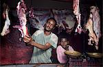 Ethiopia, Harar. A butcher and his son in their shop in Harar's Muslim meat market.