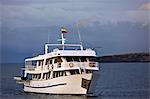 Galapagos Islands, The motor yacht Galapagos Voyager arrives off Genovese.