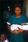 Ghana,Volta Region,Hohoe. Midwife nurse with a baby.