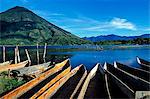 Boats moored on the banks of Lake Atitlan and Atitlan volcano from the town of San Lucas. The Lake is Approx 15 sq Kms and parts of it reach 300meters deep. The 13 villages on the shores retain a distinctly Mayan atmosphere.