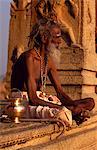 A wandering ascetic or sadhu,rests in the porch of a shrine on Hemakuta Hill