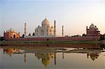 Taj Mahal at sunset with Yamuna River in foreground,Agra,India