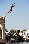 A man jumps into Lake Pichola on a hot day in Udaipur,Rajasthan. India