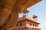 Architectural detail of ornately carved stone roof line,looking towards the Diwan-I-Kas is also known as the The Jewel House or the Ekstambha Prasada (Palace of Unitary pillar). Uttar Pradesh,Fatehpur Sikri,Agra District. India