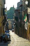 Italy,Tuscany,Siena. View along one of Siena's narrow medieval streets.