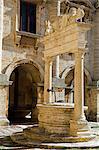 Italy,Tuscany,Montepulciano. An elegant Renaissance well-head,the Griffin Well or Pozzo dei Grifi,in Montepulciano's main square,Piazza Grande.