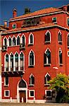 Italy, Veneto, Venice; One of the countless Venetian Palaces, brightly coloured, with typical Venetian Windows