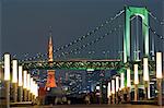 Rainbow Bridge and Tokyo Tower,people in the foreground taking an evening stroll.