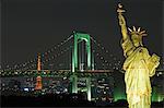 Tokyo skyline at night including the Tokyo Tower,the Rainbow Bridge and the Statue of Liberty.