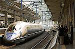 Japan,Honshu Island,Kyoto Prefecture,Kyoto. The bullet train at Kyoto Station.