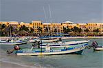 Playa del Carmen, Mexico. Fishing charter boats on the beach in Playa del Carmen Mexico