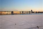 Russia, St.Petersburg; People walking across the partly frozen Neva River.