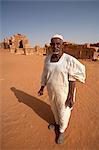 Sudan, Nagaa. The solitary guide at the remote ruins of Nagaa stands in front of the ruins.