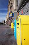 Yellow and blue postboxes outside Central Post Office, Kiev, Ukraine