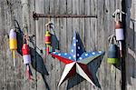 Fishing buoys on the side of a barn in New Hampshire, USA.