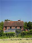 Exterior of traditional house with modern extension. Architects: David Rea Architects